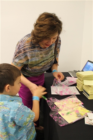 Cindy and Jesse Warschauer pack study kits for Girls Inc after-schoolers
